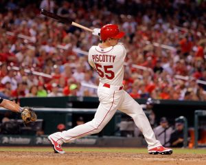 St. Louis Cardinals' Stephen Piscotty hits an RBI-single during the seventh inning of a baseball game against the Colorado Rockies, Saturday, Aug. 1, 2015, in St. Louis. (AP Photo/Scott Kane)